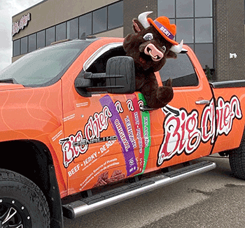 Bert the Bull loving his new ride to help drive him around so he can hand out samples